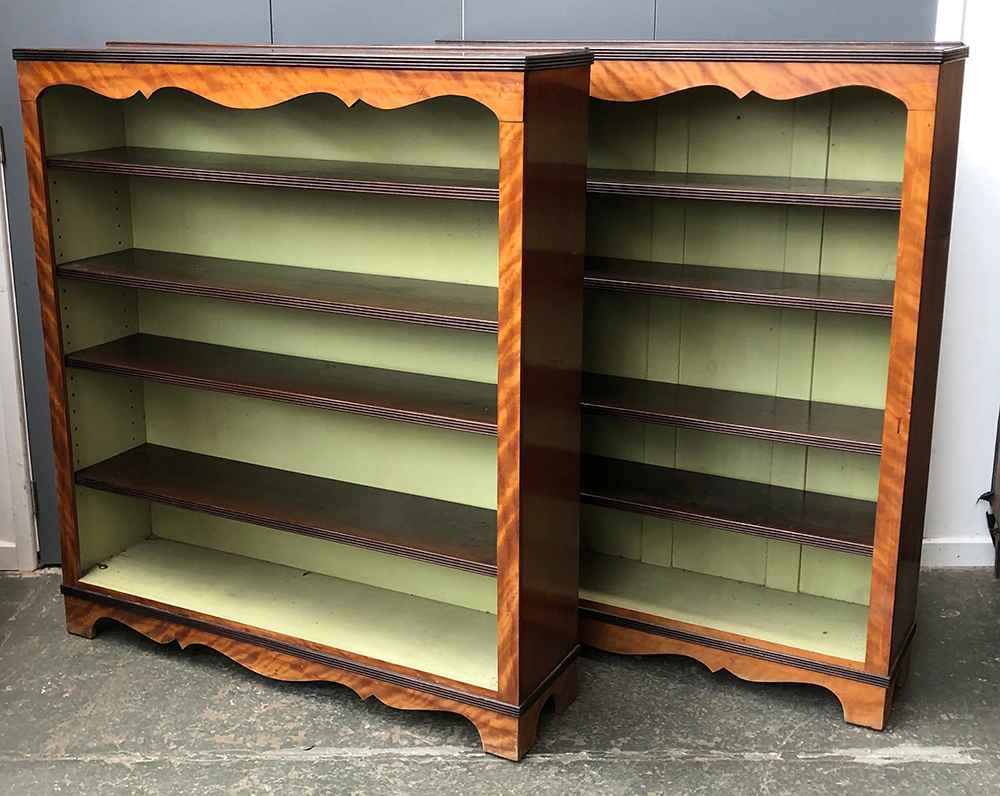 A pair of mahogany and satin birch bookshelves, each with four adjustable shelves, 114x27x127cmH (2)