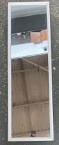 A small white painted long mirror, 114x35cm