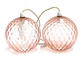 A pair of pink glass ceiling pendant lights, approx. 27cmD