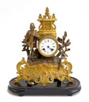 An early 20th century French gilt metal figural mantel clock, enamel dial with Roman numerals,