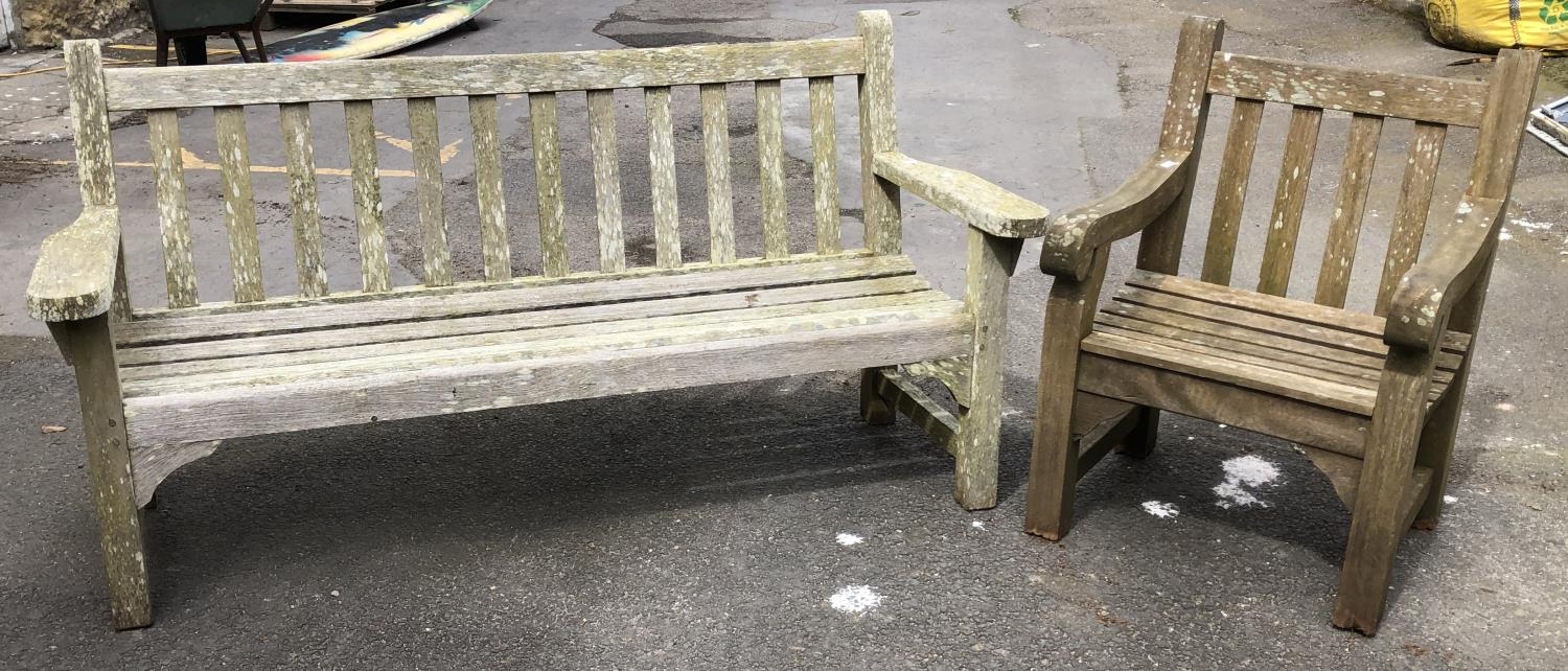 A teak slatted garden bench, approx 161.5cmW; together with a chair 59cmW