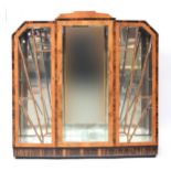 A figured walnut and Macassar ebony Art Deco style display cabinet, the stepped top with similar
