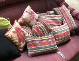 A quantity of striped and other scatter cushions