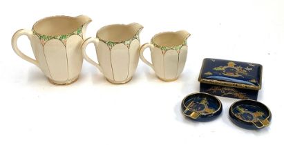 A set of three graduating Royal Norfolk art deco jug, the tallest 14cmH; together with A Carlton