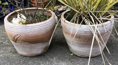 A pair of terracotta planters with foliate design, 35cmH 45cmD