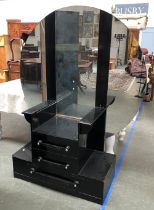 An Art Deco black painted oak dressing stand, with three part circular mirror, above a stepped