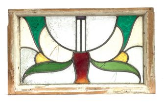 An early 20th century stained glass panel in a pine frame, 64x38cm