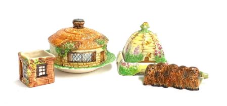 A Beswick cottage cloche; a Royal Winton Grimwades beehive (af); Beswick dogs etc