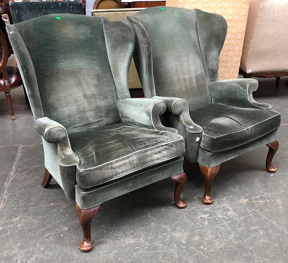 A pair of green Parker Knoll PK976 wingback armchairs