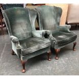 A pair of green Parker Knoll PK976 wingback armchairs