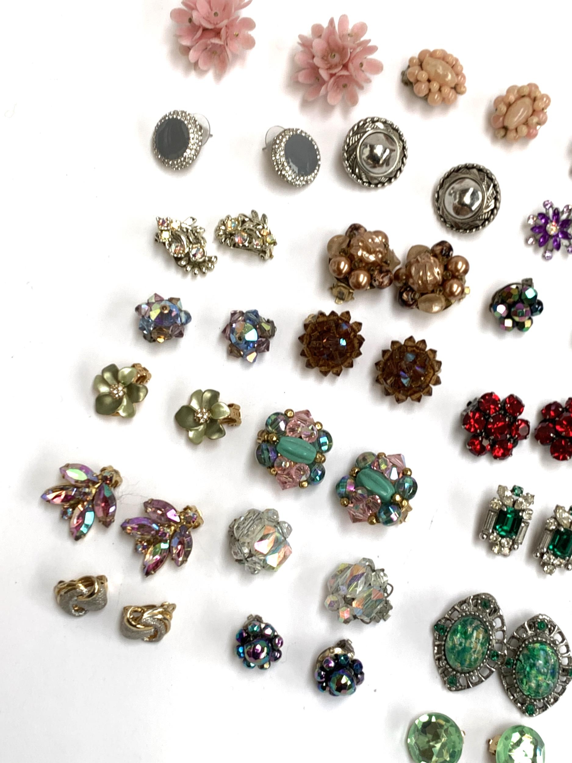 A quantity of costume clip on earrings, some purple and green tone, aurora borealis crystal etc - Image 2 of 4