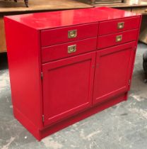Interior design interest: a red lacquered sideboard, four drawers over two locking doors, with