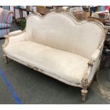 A 20th century carved gilt gesso sofa, with ribbon cresting, in need of reupholstry, 181cmW