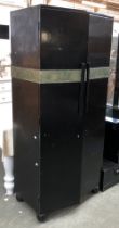 An early 20th century black painted Art Deco wardrobe with applied metal banded decoration, the