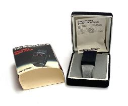A vintage Sinclair electronic digital watch 'The Black Watch' boxed with original slip