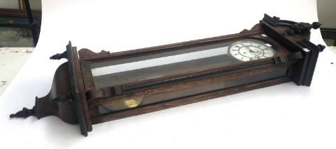 A 20th century mahogany cased wall clock, enamel dial with Roman numerals, 120cmL