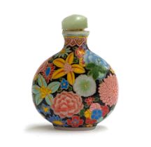 A late 19th/early 20th century Chinese glass snuff bottle, with polychrome enamel profuse floral