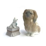 Two Lladro dog figurines: 'My Favourite Companion', model no. 6985; and 'Pekingese dog', model no.
