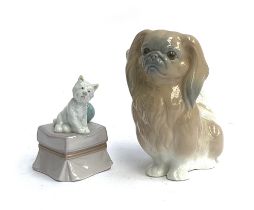 Two Lladro dog figurines: 'My Favourite Companion', model no. 6985; and 'Pekingese dog', model no.