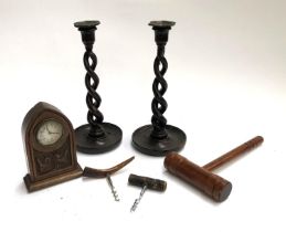 A small lot of wooden items to include a pair of double helix candle sticks, mantle clock, cork