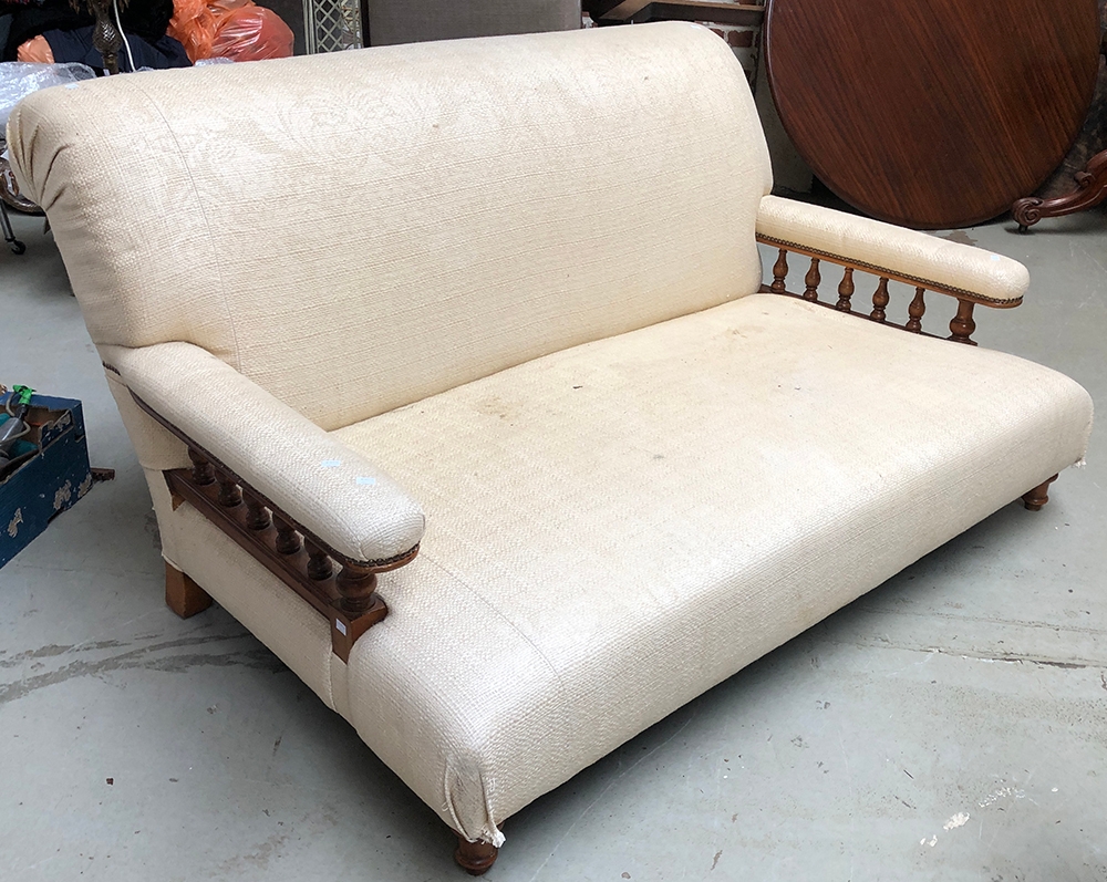 A deep seated country house sofa with turned underarm supports and turned front legs, approx.