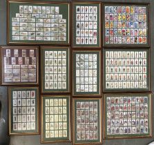 A quantity of framed and glazed cigarette cards to include Player's, Will's, and Carreras