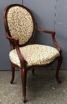 A carved stained beech open armchair in Louis XV taste; together with a Regency mahogany open