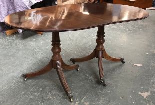 A mahogany twin pedestal D end dining table in Regency style, 96cmW 74cmH 150cmL when closed, the