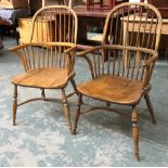 A pair of 20th century ash and elm Windsor armchairs, the ball and cove turned legs joined by