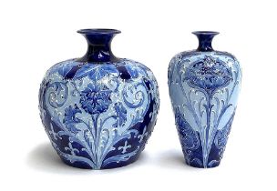 Two William Moorcroft for Macintyre Florian Ware, Burslem, tubeline blue vases, with allover