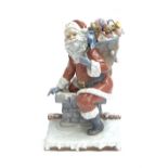 A Lladro figurine 'Down The Chimney Santa' limited edition 378/1500, sculpted by Francisco Polope,