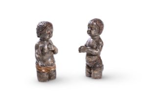 A companion pair of silvered and giltwood models of putti, 18th century, one modelled with hands