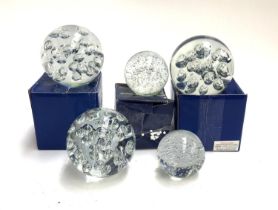 Five glass paperweights, each of bubble form, each approx. 12cmH