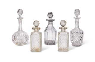Five cut glass decanters with stoppers, late 19th and 20th century, including a pair of spirit