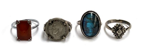 A smalll quantity of silver rings to include art deco butterfly wing; 1941 threepence ring;
