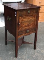 A George III mahogany washstand with blind drawer, cupboard and single drawer, the square tapered
