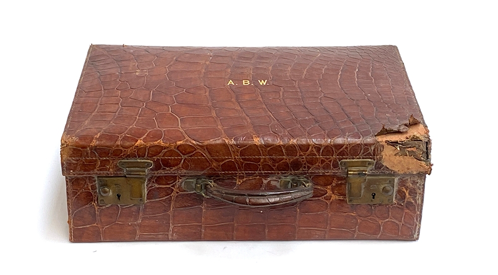 A vintage alligator suitcase (af), monogrammed A.B.W, 50cmW