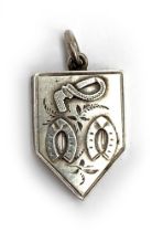 A Victorian silver locket, with whip and horseshoe design, engraved May 13th 1890, 1.7cmW;