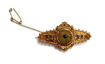 A Victorian 15ct gold bar brooch set with a central sapphire, 4.3cmL, 4.8g
