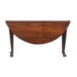 A George II mahogany oval gateleg table, of good proportions, on tapering legs with pad feet