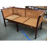 A smart 20th century oak bergere settee with double caned sides and back and cane seat, 171x70x86cmH