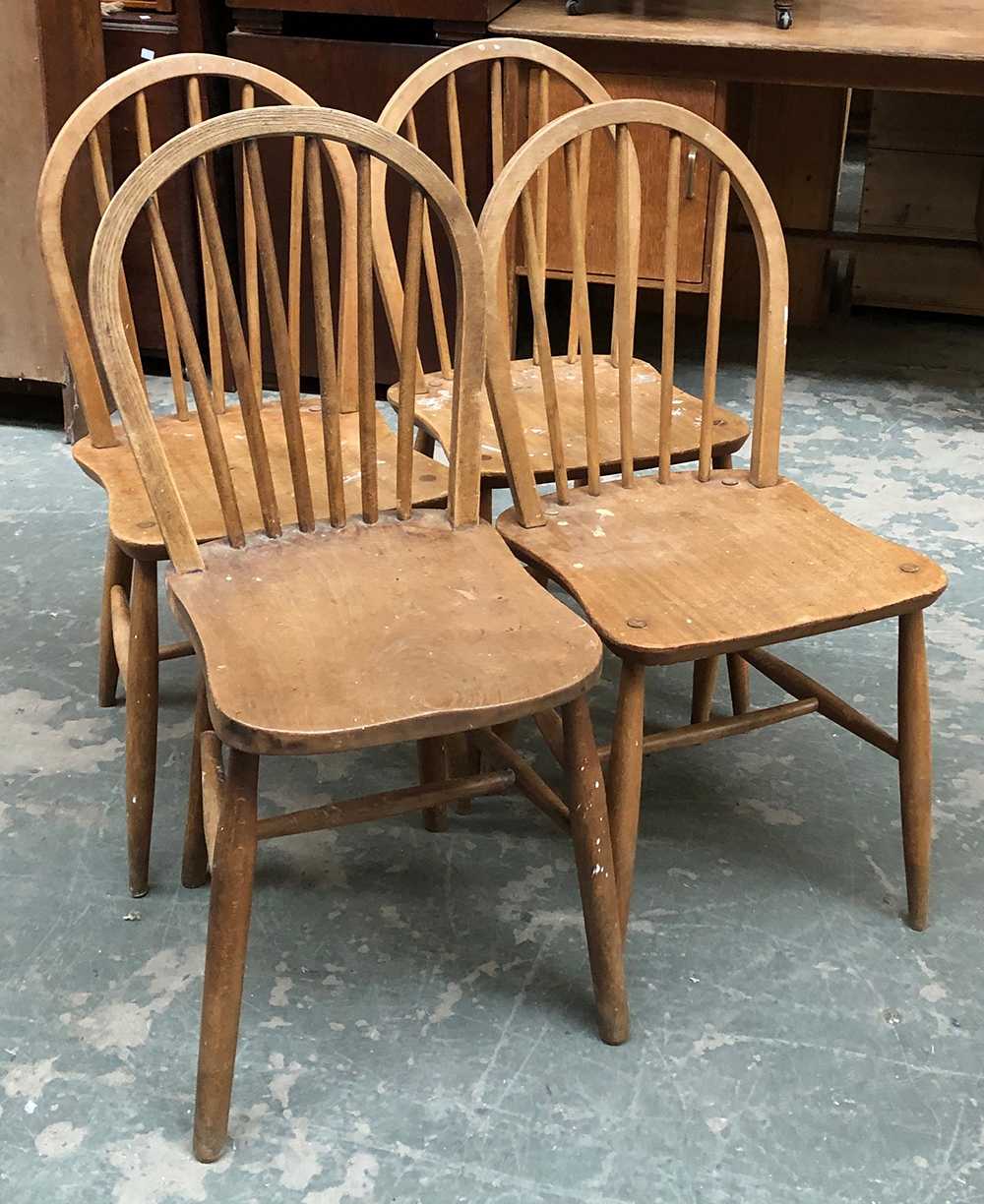 A set of four Ercol hoop back kitchen chairs, stamped