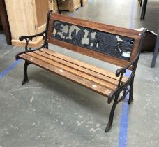 A child's garden bench with cast metal safari back