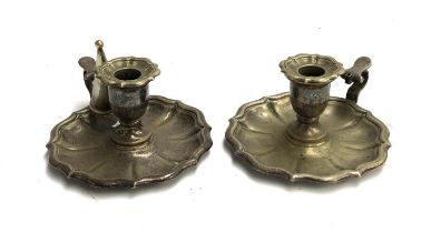 A pair of silver plated candlesticks, 17cmW 8cmH