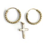 A 9ct gold crucifix, approx. 0.6g; together with silver gilt hoop earrings