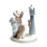 A Lladro figure group, 'Holiday Wishes', no. 8010, 25cmH, in original box