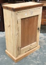 A small pine cupboard with single door, opening to three shelves, 61x31.5x88cmH