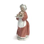 A Lladro porcelain figurine of 'Mrs Santa' 6893 from Santa's Magical Workshop, with original box