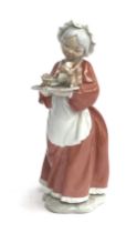 A Lladro porcelain figurine of 'Mrs Santa' 6893 from Santa's Magical Workshop, with original box