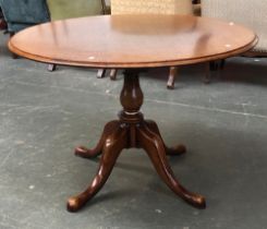 A circular oak table by Titchmarsh & Goodwin, on balsuter column and cabriole pad feet, bears plaque